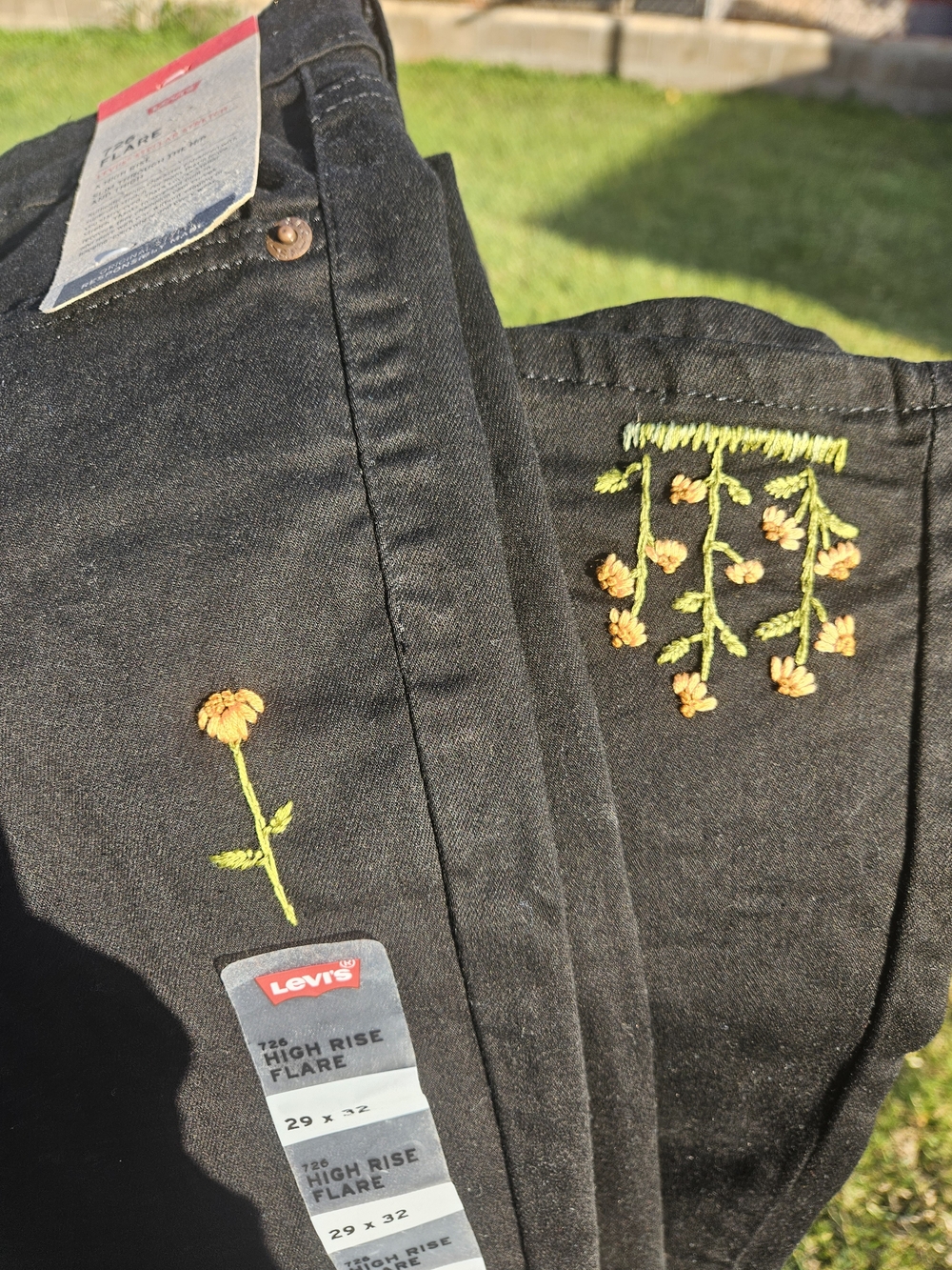 Levi's Black High-Rise Flare Jeans with Yellow Embroidered Flowers